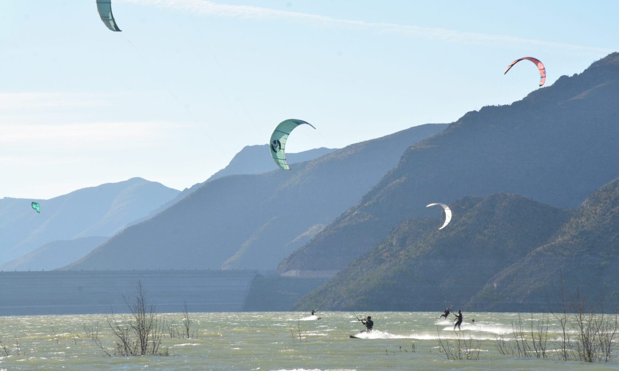 Advanced kitesurfer practicing jumps and tricks during a coaching session in Puclaro