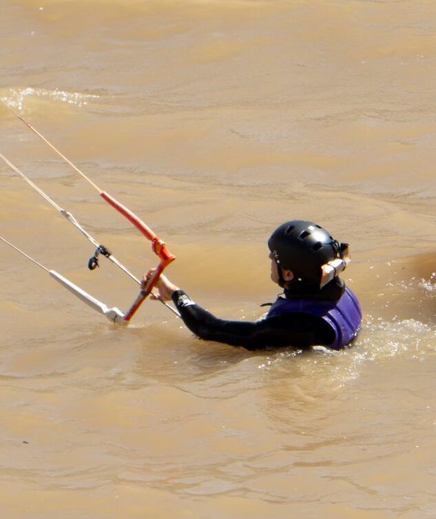 Instructor and student practising body drag in the water at Puclaro Reservoir